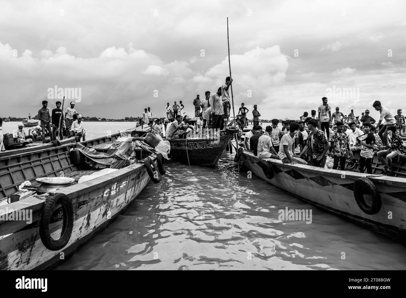 Traditional boat station, people's lifestyle, and cloudy sky photography captured on June 25, 2022, from Mawa boat station, Bangladesh Stock Photo