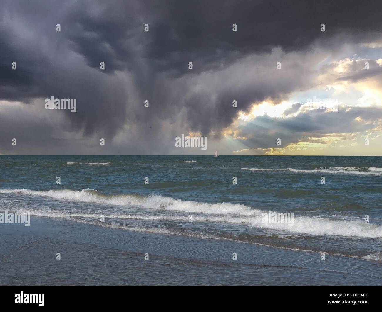 Summer storm clouds over the ocean and beach hi-res stock photography ...
