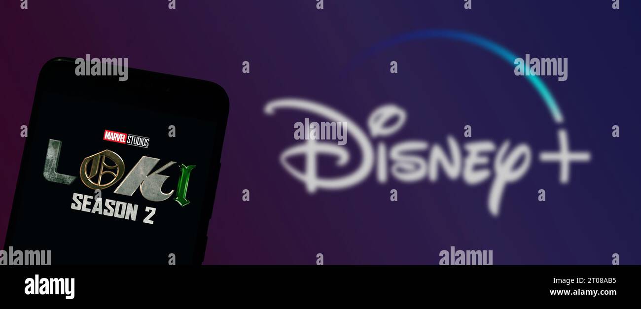 Buenos Aires, Argentina; 10-02-2023: Marvel Studios’ Loki Season 2 logo on smartphone screen with Disney Plus on screen in the background. Stock Photo