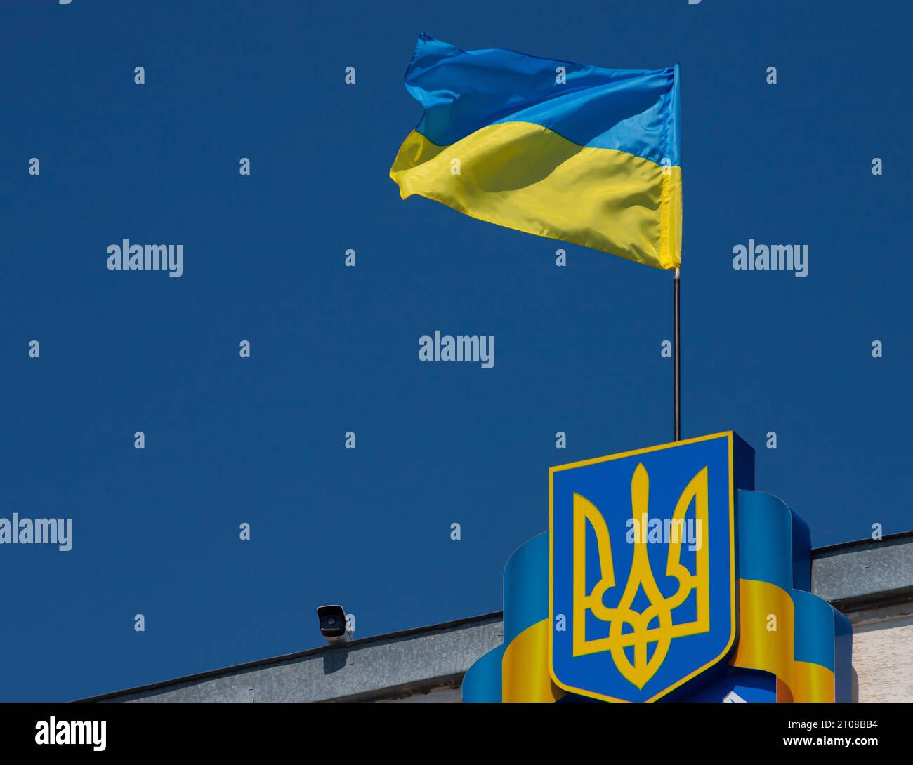 flag and coat of arms of Ukraine on sky background Stock Photo