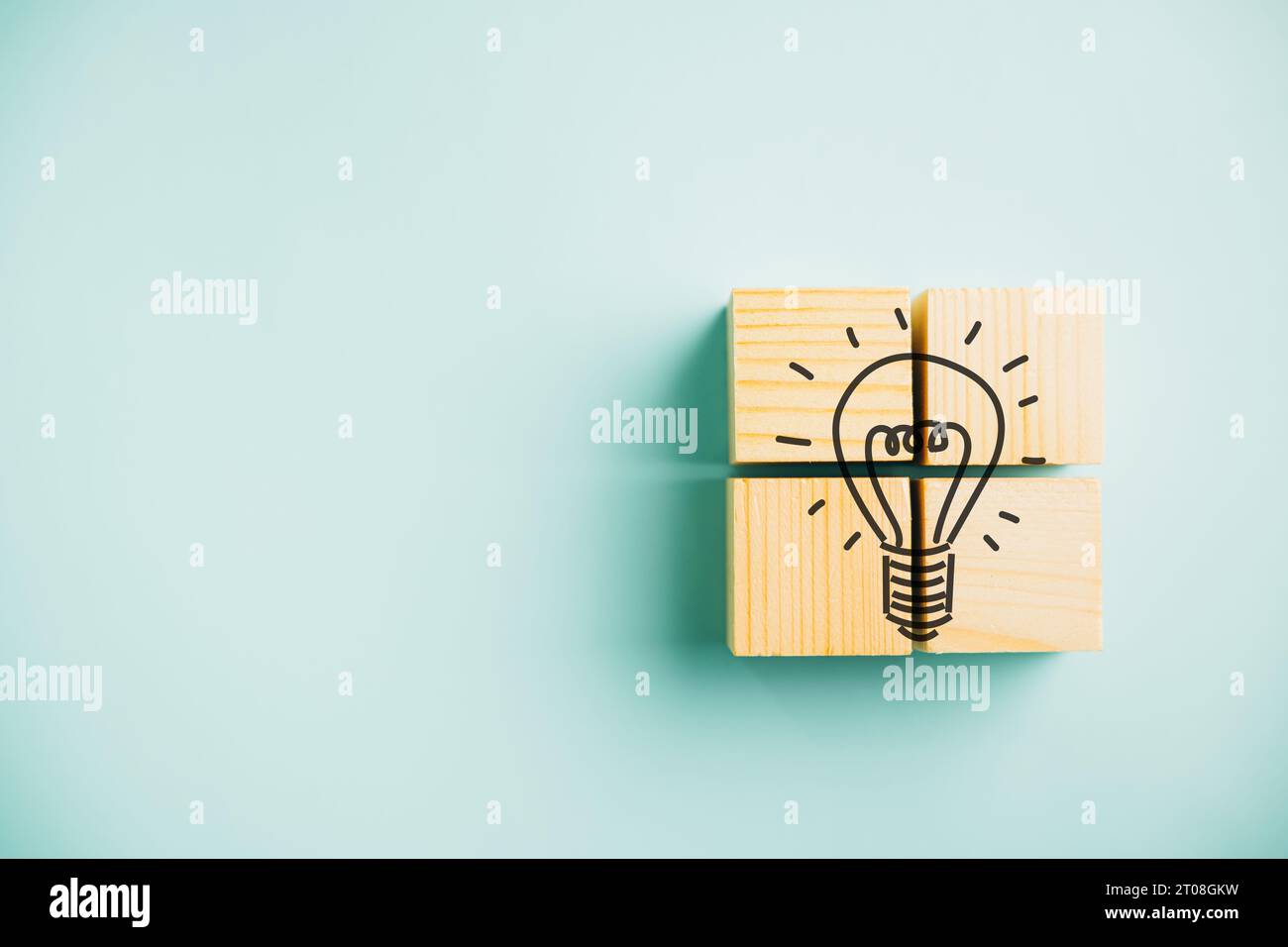 Idea and creativity concept portrayed through a wooden cube with a ...