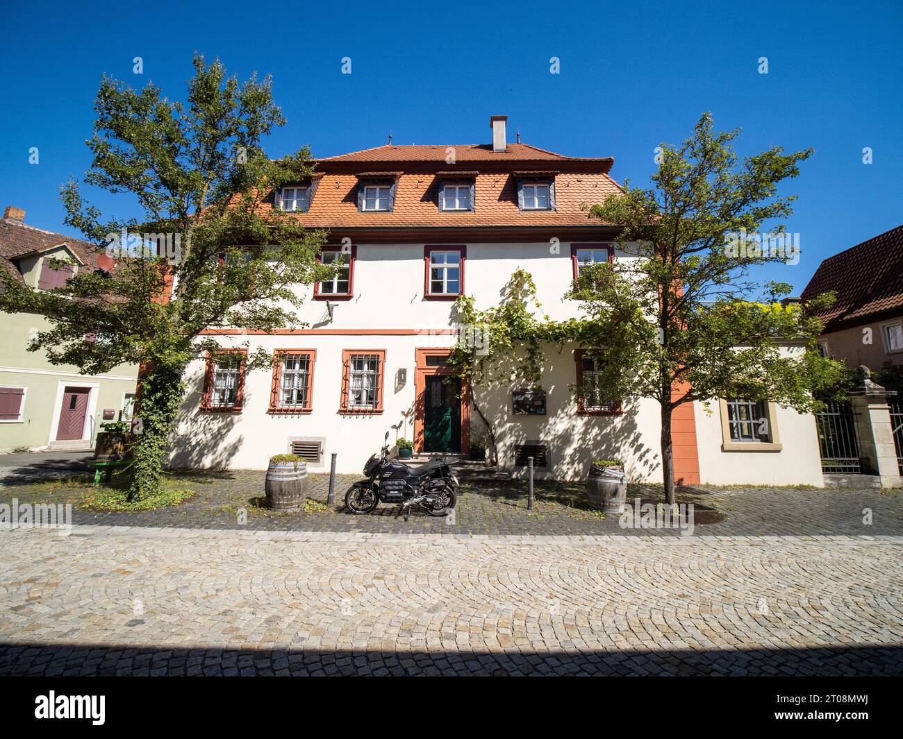 Motorbike in front of a house, Iphofen, district of Kitzingen, Lower Franconia, Bavaria, Germany Stock Photo