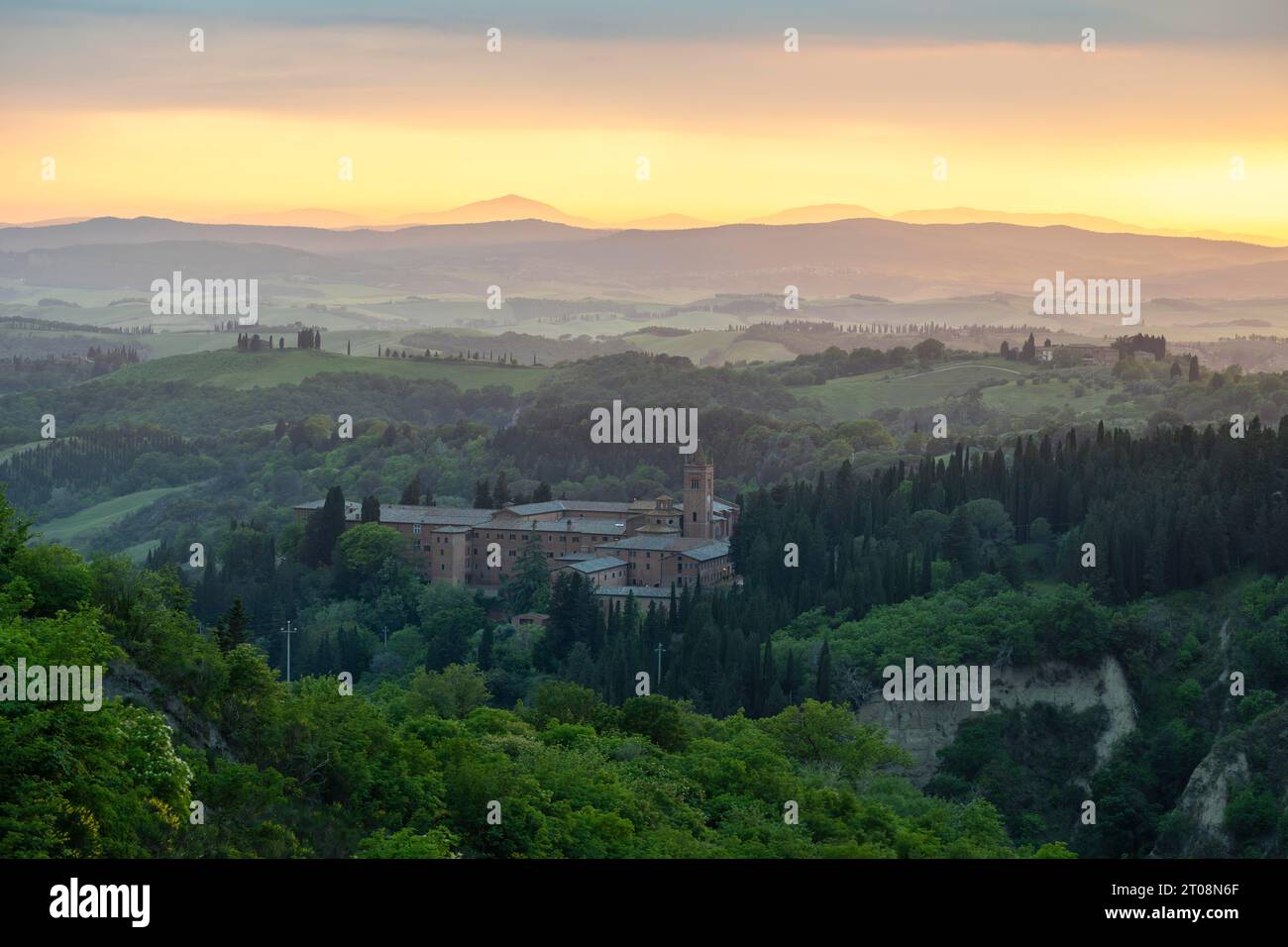 Abbey Abbazia di Monte Oliveto Maggiore, evening light, Chiusure, Asciano, Crete Senesi, province of Siena, Tuscany, Italy Stock Photo
