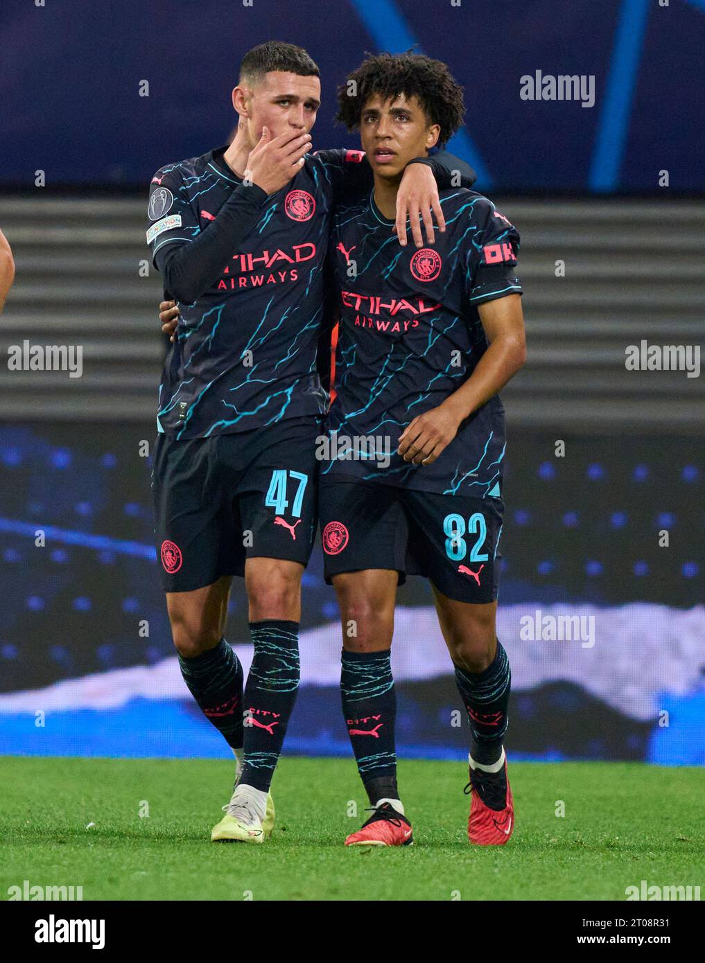 Phil Foden, MANCITY 47 celebrates his 0-1 goal, happy, laugh, celebration, with Rico Lewis, MANCITY 82  in the group G stage match  RB LEIPZIG - MANCHESTER CITY 1-3 of football UEFA Champions League in season 2023/2024 in Leipzig, Oct 4, 2023.  Gruppenphase, , RBL, Red Bull © Peter Schatz / Alamy Live News Stock Photo