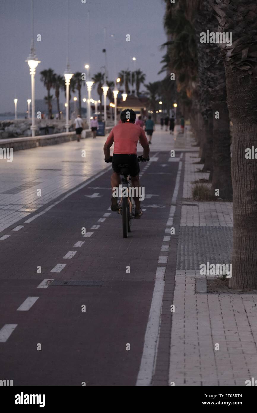 Man riding a bike crossing the pedestrian Stock Photo