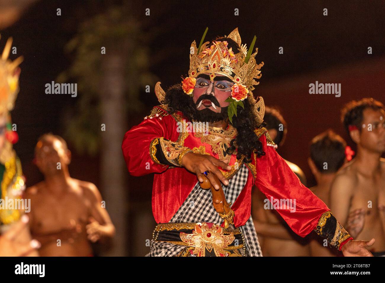 Image of particpants in a fire ceremony at a temple in Bali Indonesia Stock Photo