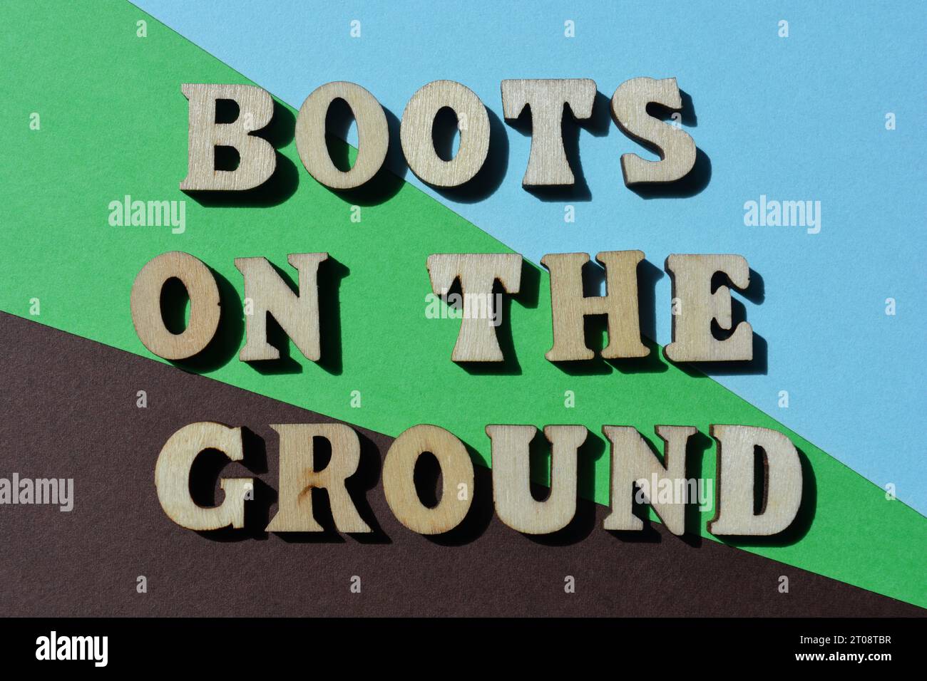 Boots on the Ground, words in wooden alphabet letters isolated on
