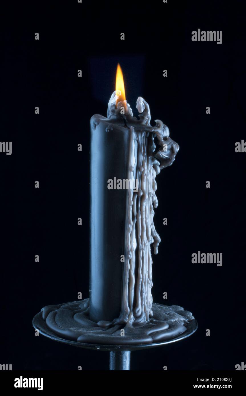 Burning candle with dripping wax hi-res stock photography and images ...