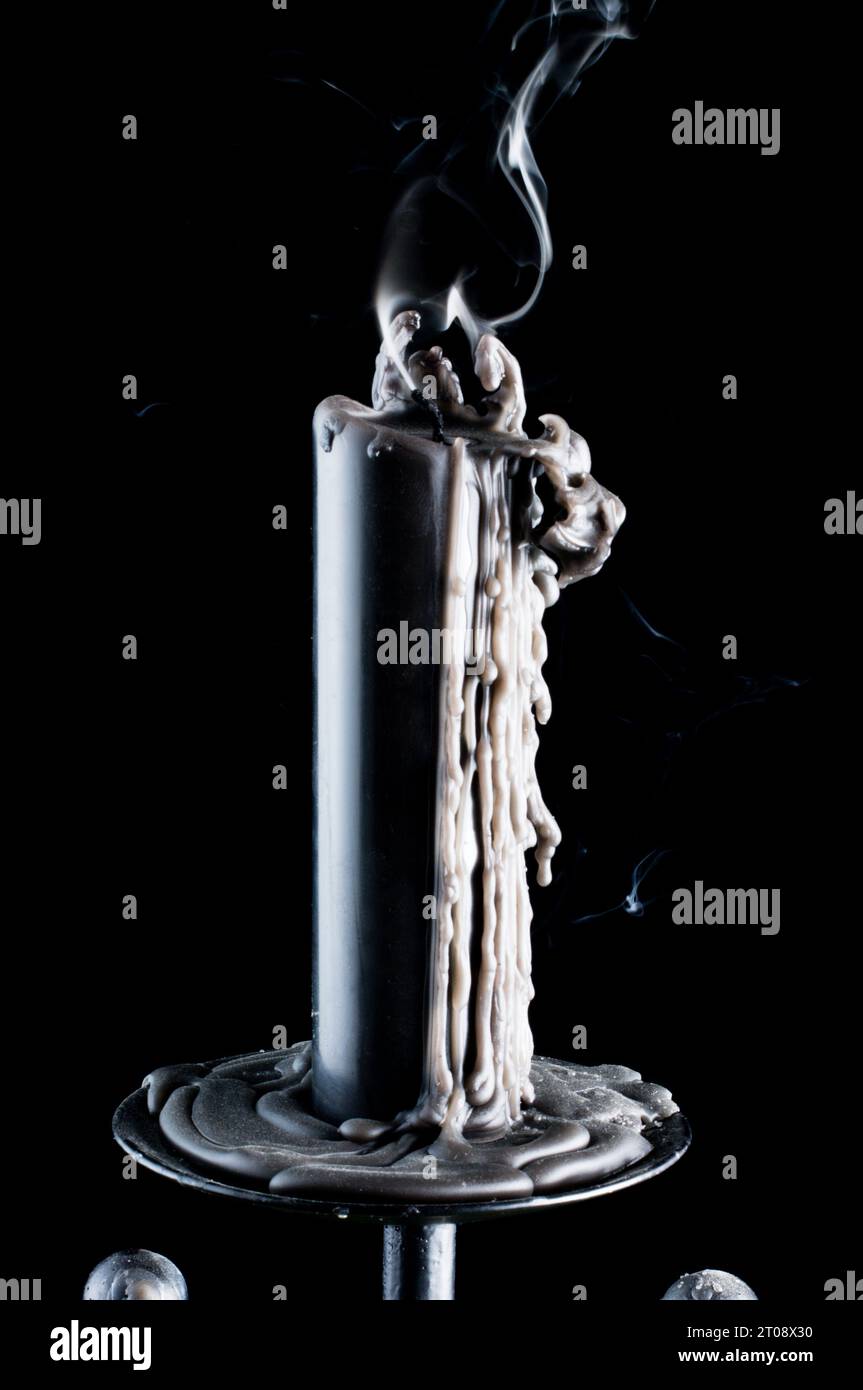 Snuffed out black candle Stock Photo Alamy