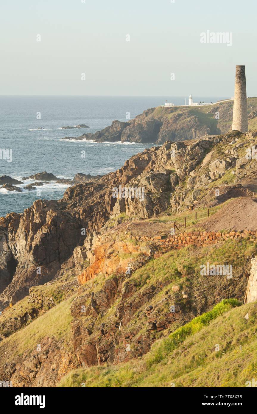 View to Pendeen Lighthouse with tin mining spoil heaps in the foreground - John Gollop Stock Photo
