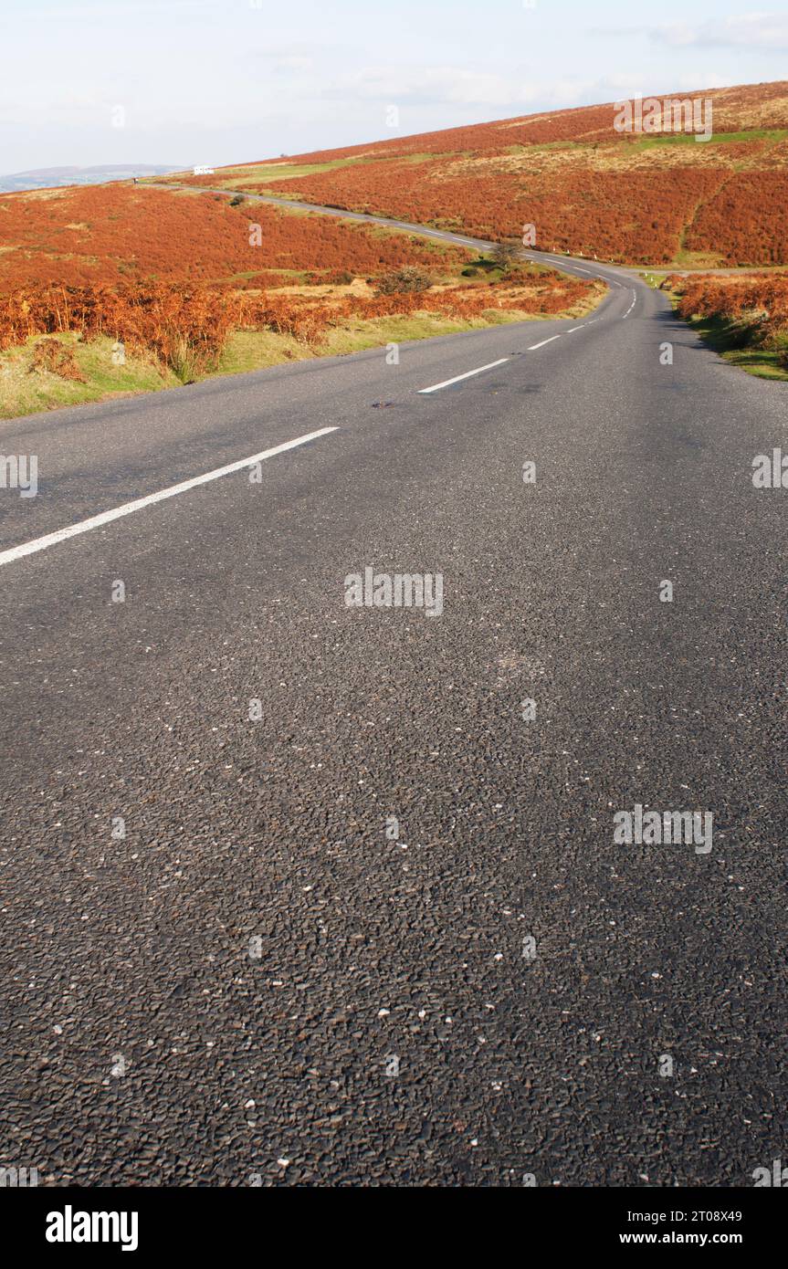 Empty road crossing Dartmoor National Park, Devon, UK - John Gollop Stock Photo