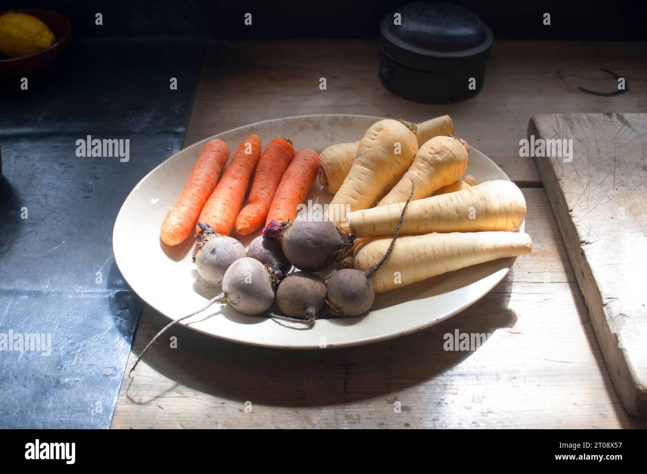 Assorted vegetables on a victorian table top - John Gollop Stock Photo