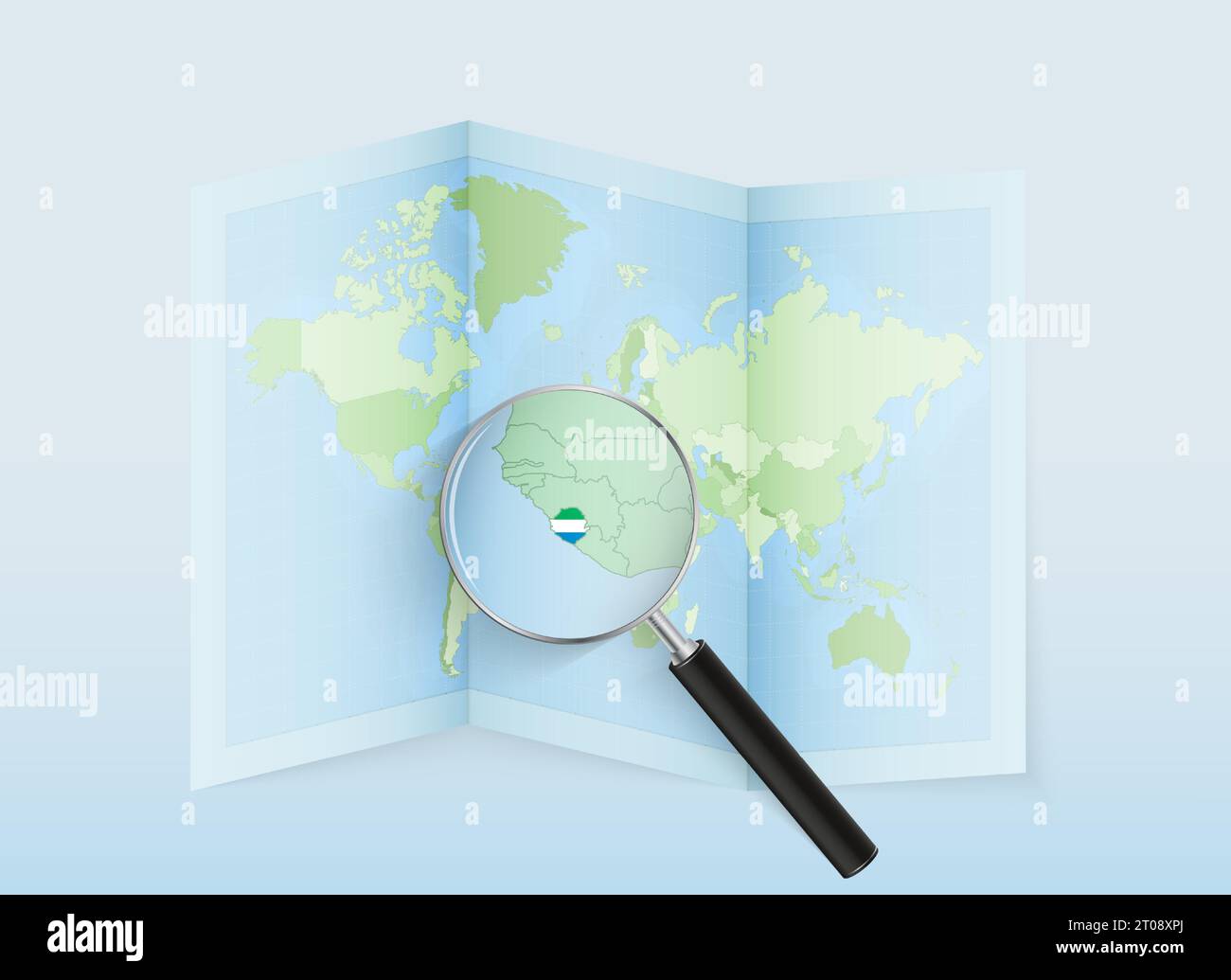 A folded world map with a magnifying lens pointing towards Sierra Leone ...