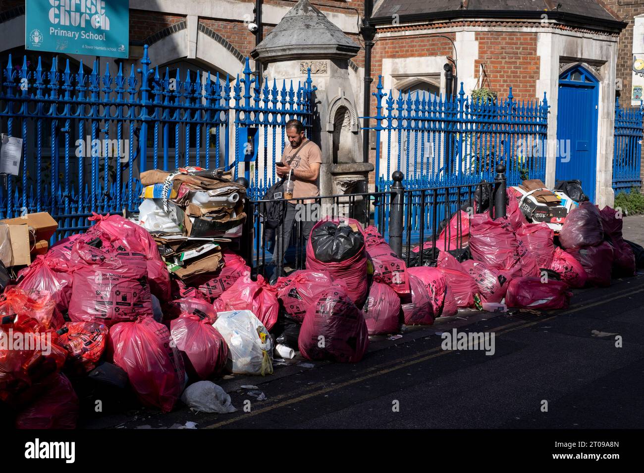 Refuse piled up along Brick Lane during four weeks of strike action by waste service workers in Tower Hamlets on 25th September 2023 in East London, United Kingdom. Tower Hamlets Council waste service workers and street cleaners are currently on strike from 18th September to 1st October. More than 200 refuse workers have downed tools after rejecting the a flat pay increase of £1,925. The industrial action has now been extended by a further two weeks after an improved offer was not tabled by management in the ongoing national pay dispute. Stock Photo