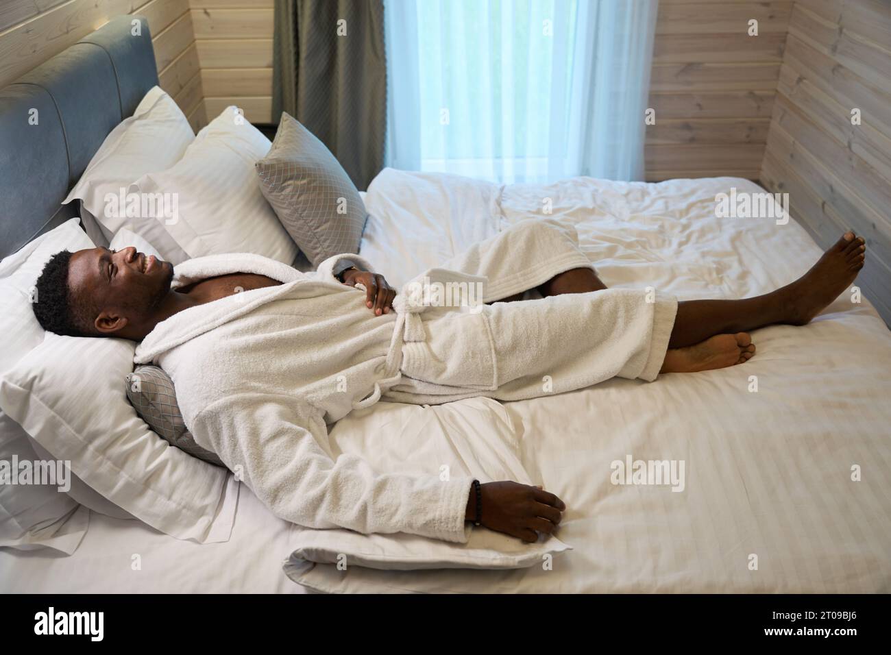 Curly handsome man in robe hi-res stock photography and images - Alamy