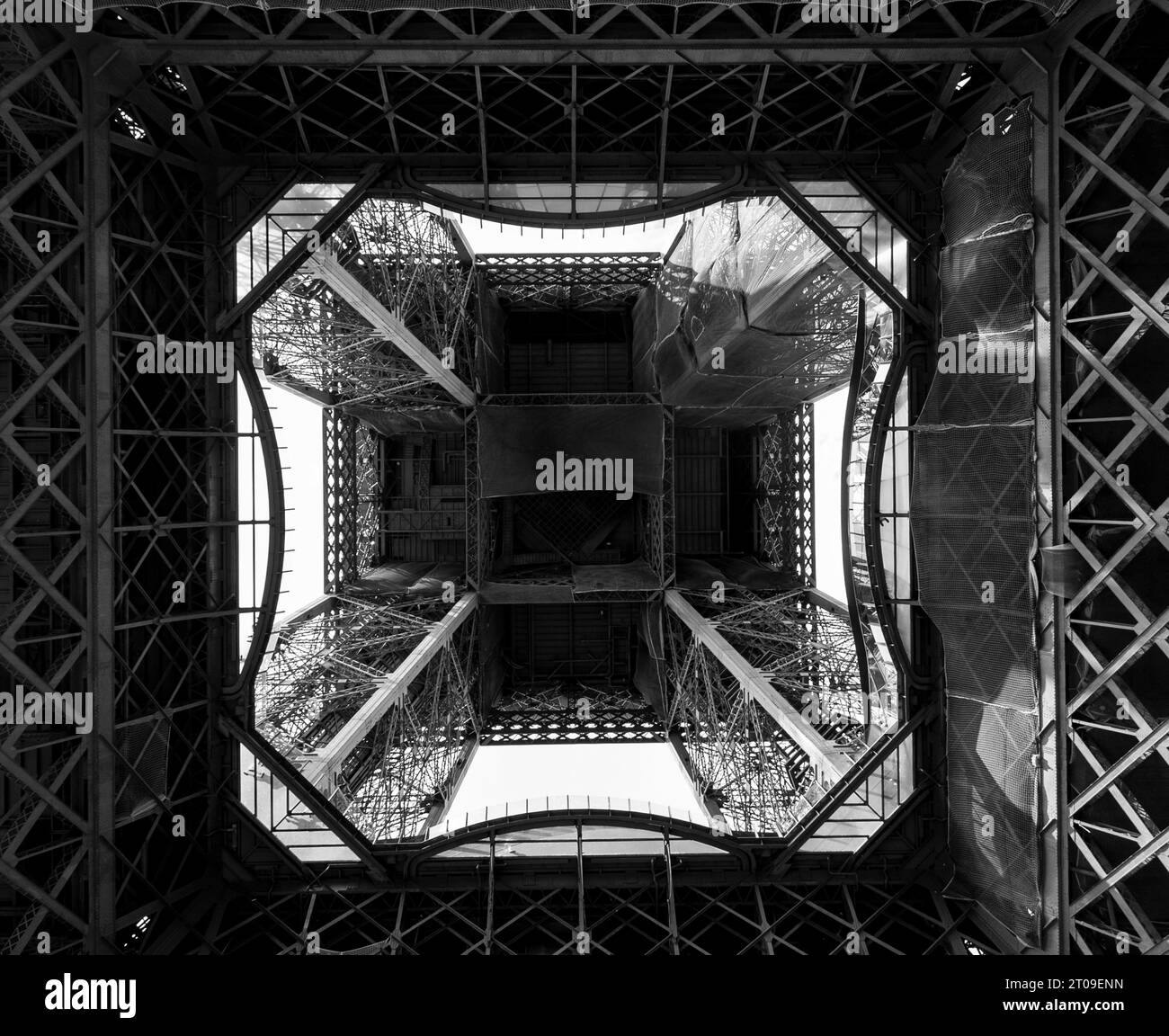 Black and white from below of iron symmetrical geometry of Eiffel Tower made of iron Stock Photo