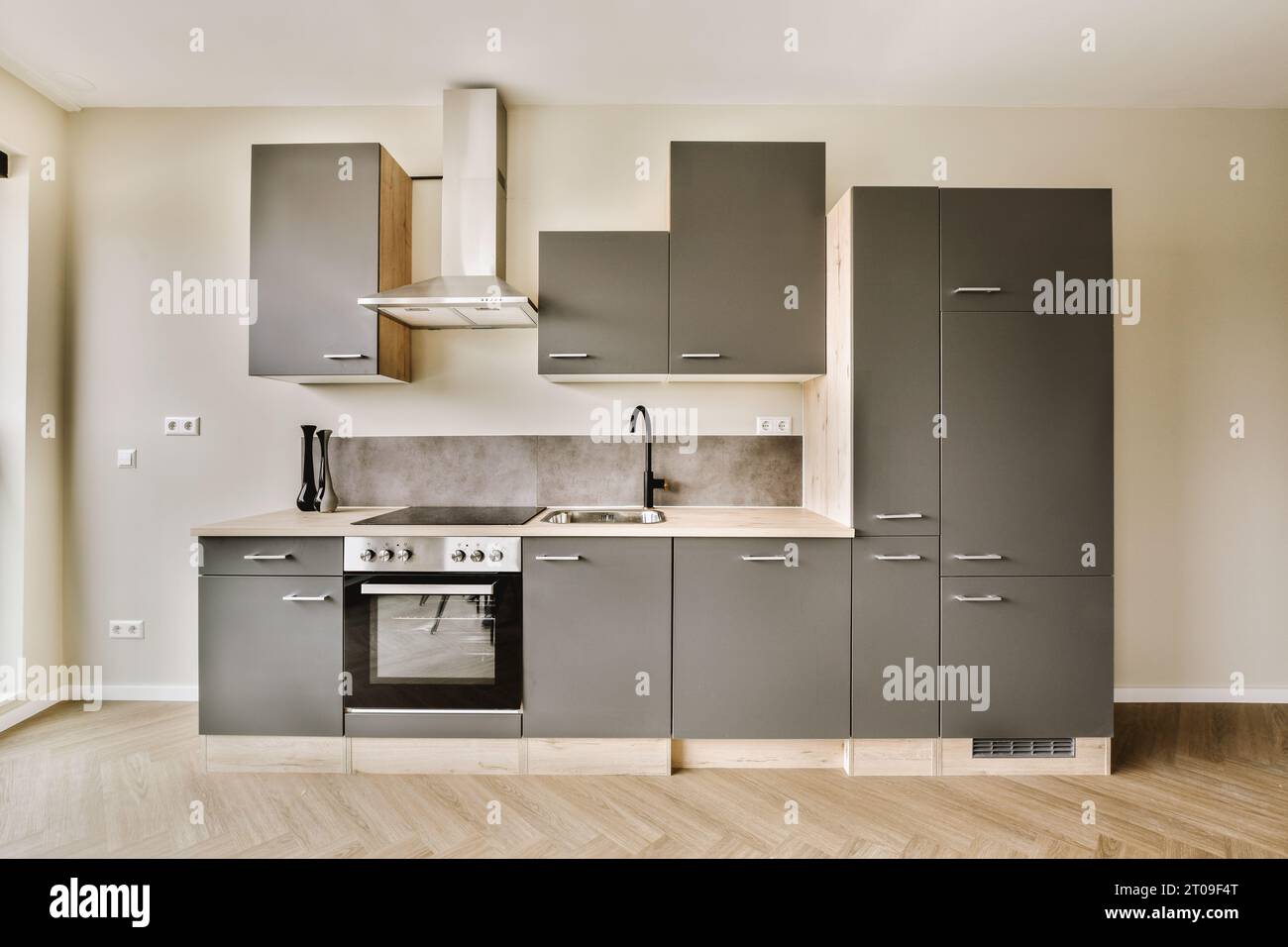 Picture of Interior of open plan kitchen with stainless steel cabinets and built ...