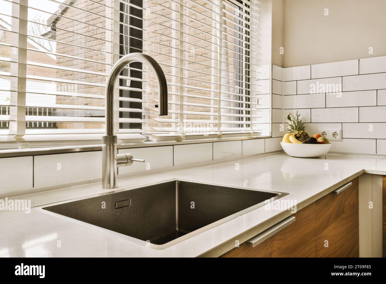 Interior Of Kitchen With Stainless Steel Faucet And Sink In Front Of Window At Home 2T09F85 