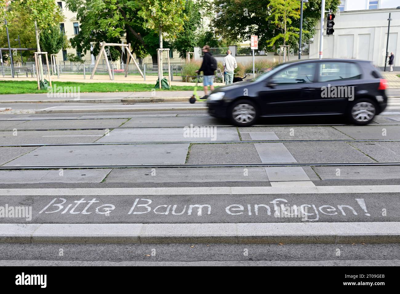 Vienna, Austria. Lettering on the asphalt: Please plant a tree Stock Photo
