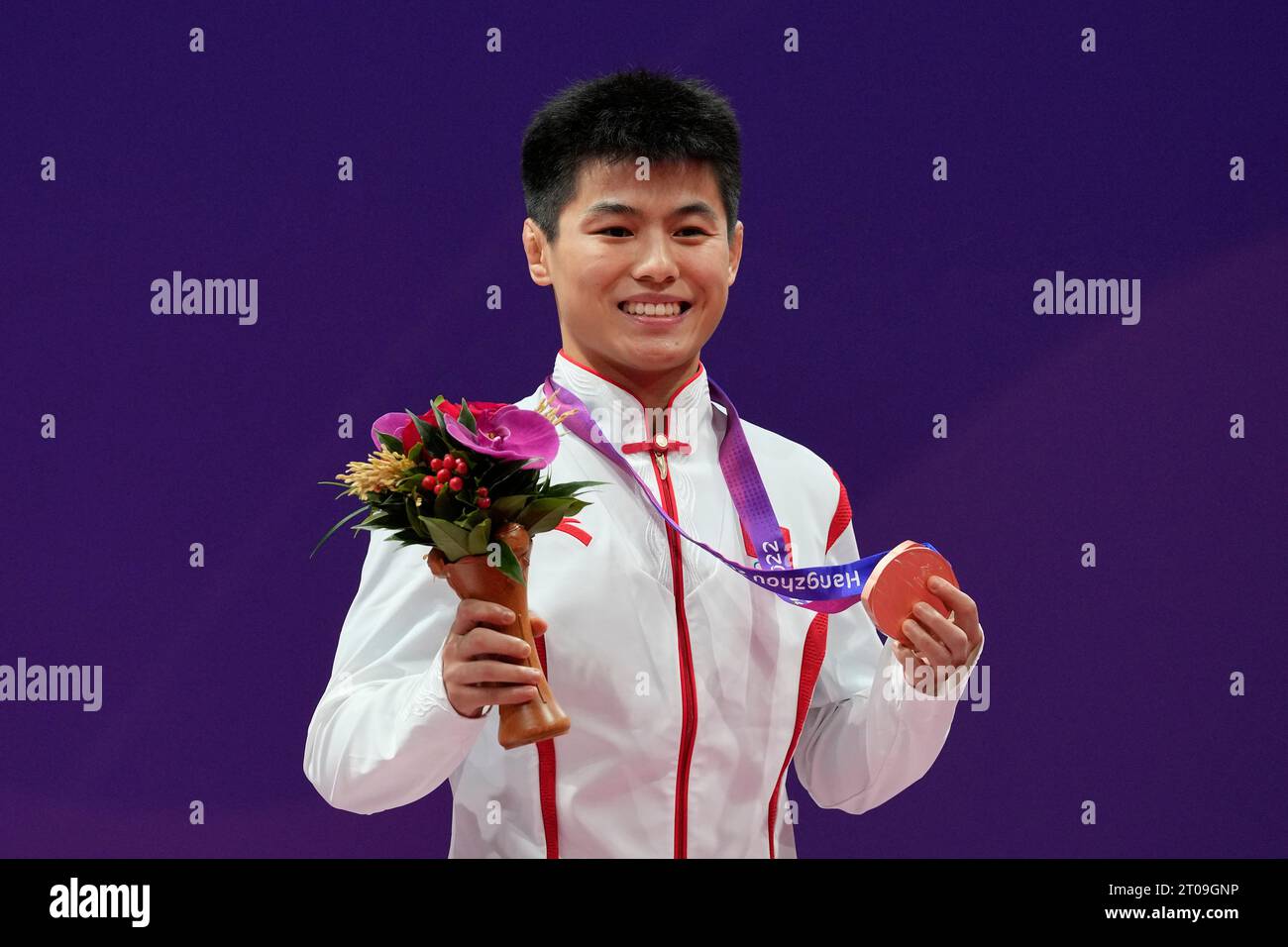 Bronze medalist China's Zhu Jiang celebrates on the podium during the ...