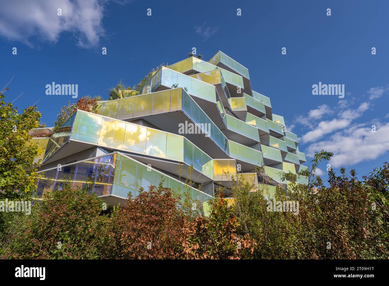 Montpellier, France - 09 23 2023 : Low angle view of modern geometric architecture of Koh-i-Noor residential building by Bernard Bühler, Port Marianne Stock Photo
