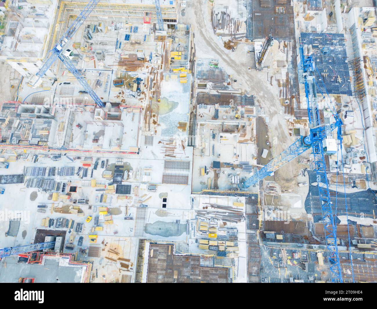 Aerial Bird Eye View Of a Construction Site Building Cranes Looking ...