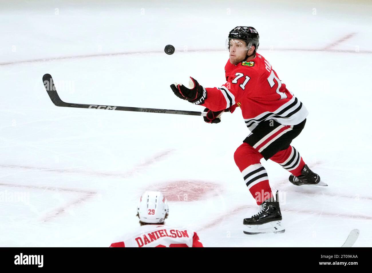 Chicago Blackhawks' Taylor Hall catches an airborne puck during an NHL