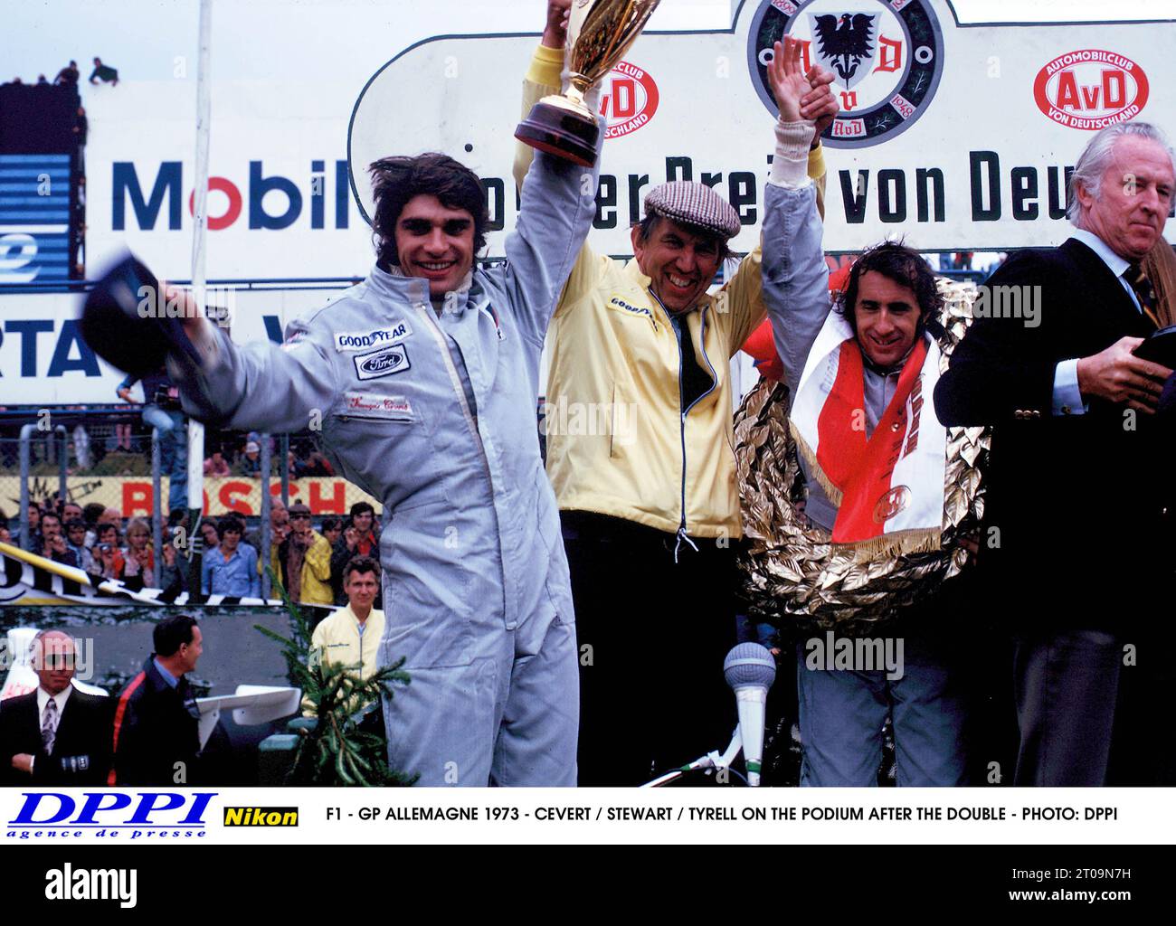 AUTO - F1 1973 - GERMANY - FRANCOIS CEVERT / JACKIE STEWART / TYRRELL ON THE PODIUM AFTER THE DOUBLE - PHOTO: DPPI KEN TYRRELL AMBIANCE PORTRAIT Stock Photo