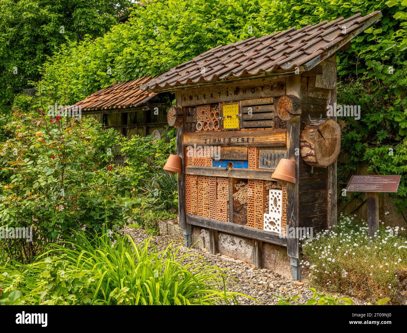 large insect hotel, free standing in the garden Stock Photo
