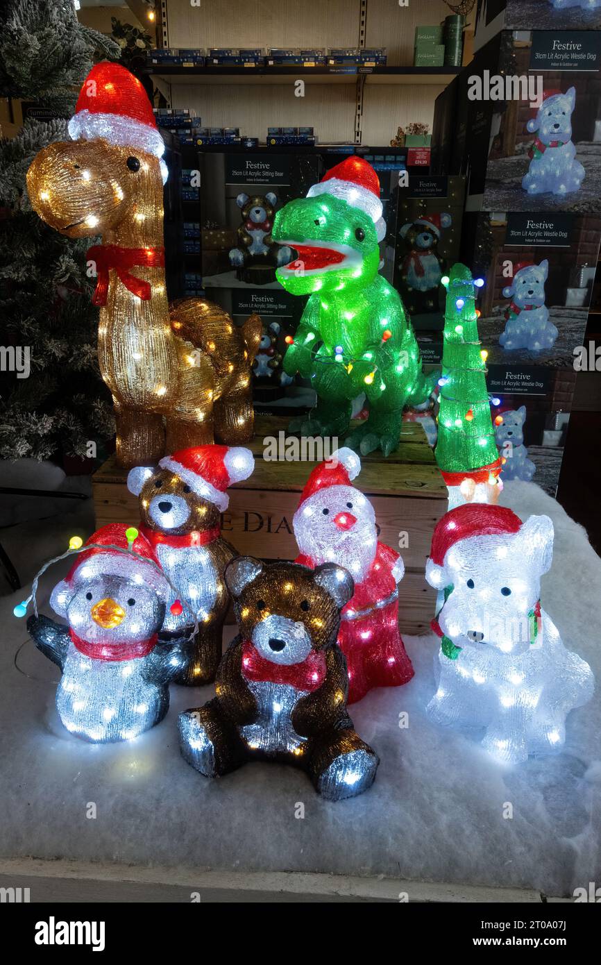 Christmas decorations for sale in a garden centre during October, England, UK. Acrylic animals with lights for outside use Stock Photo