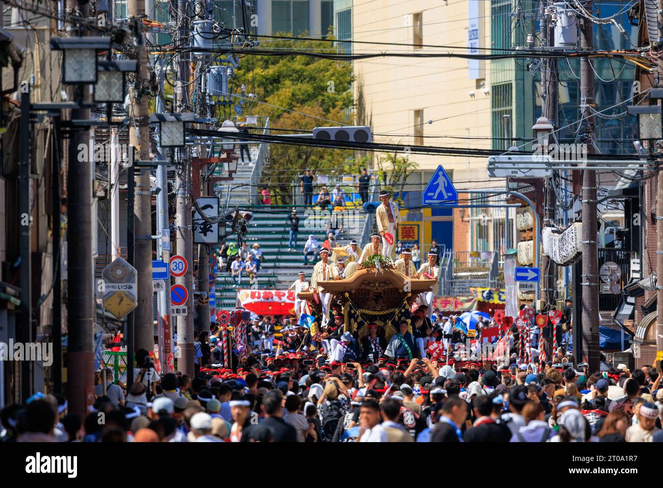 Kishiwada, Japan - September 17, 2023: Portable shrine on crowded street at summer Danjiri festival Stock Photo