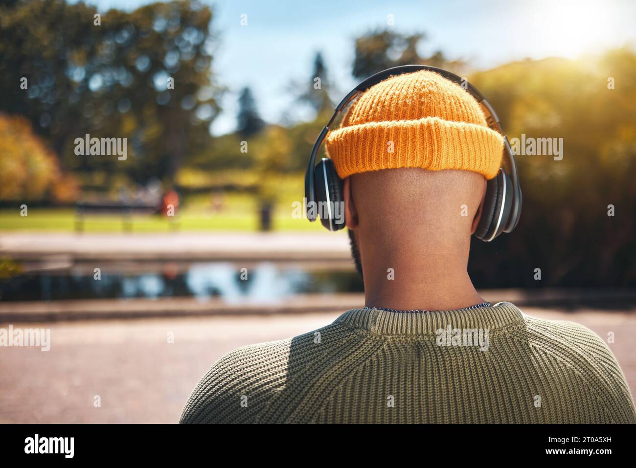 Listen Back Back view, music headphones and man outdoor, listen to audio or ...
