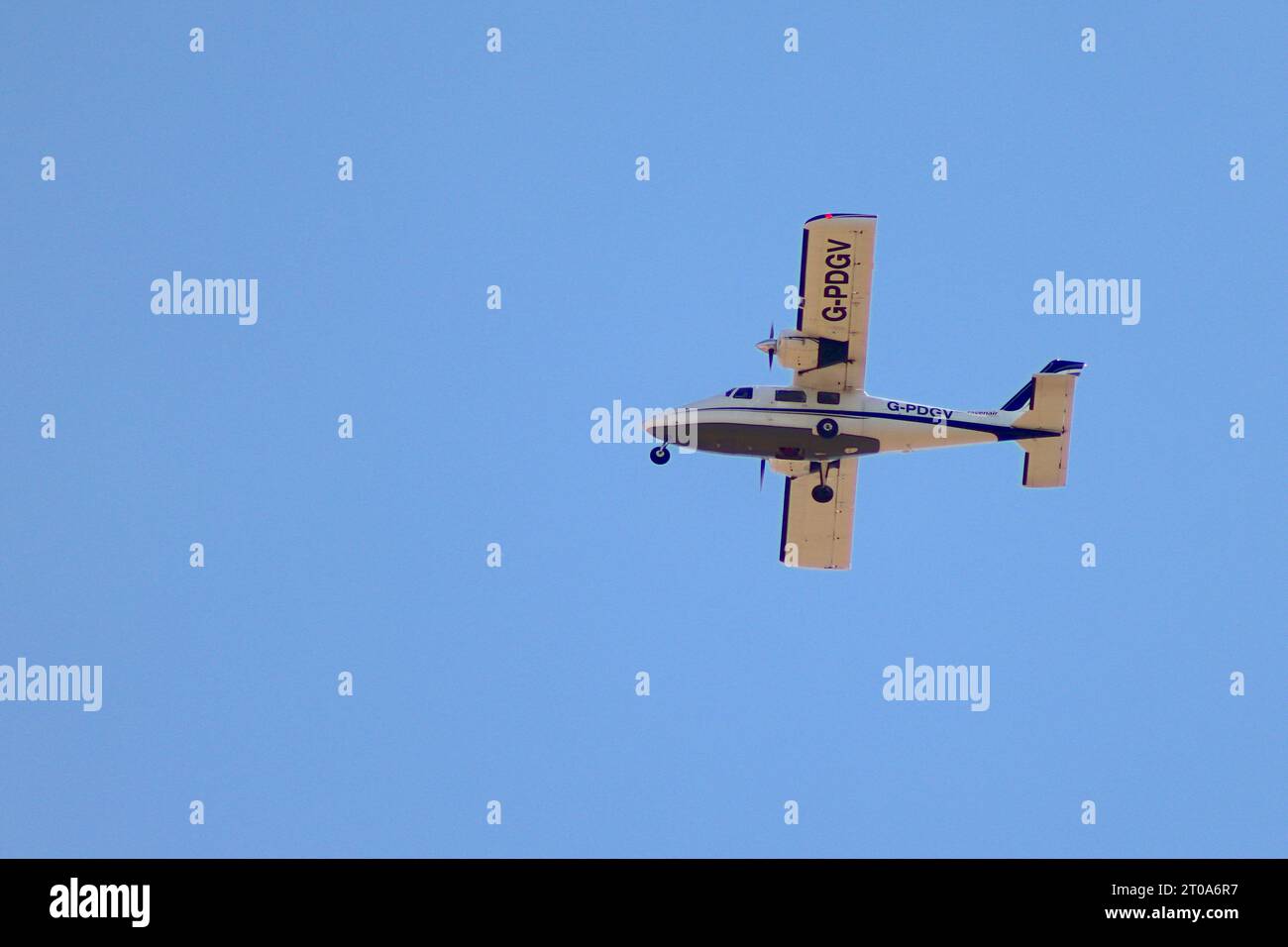 Partenavia P.68-C-TC survey aircraft operated by Ravenair conducting aerial survey work on East - West track Wembley - Denham at 1500 ft. Stock Photo