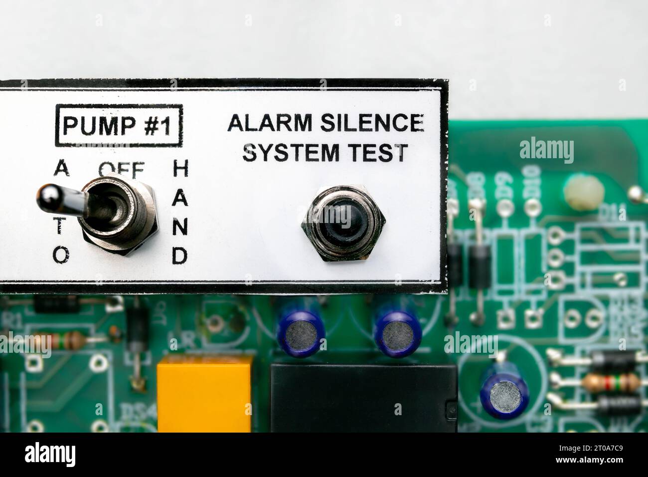 Pump  controller or pump system control panel, close up. Used in residential or commercial sump and sewage system. Focus on the alarm silence test swi Stock Photo