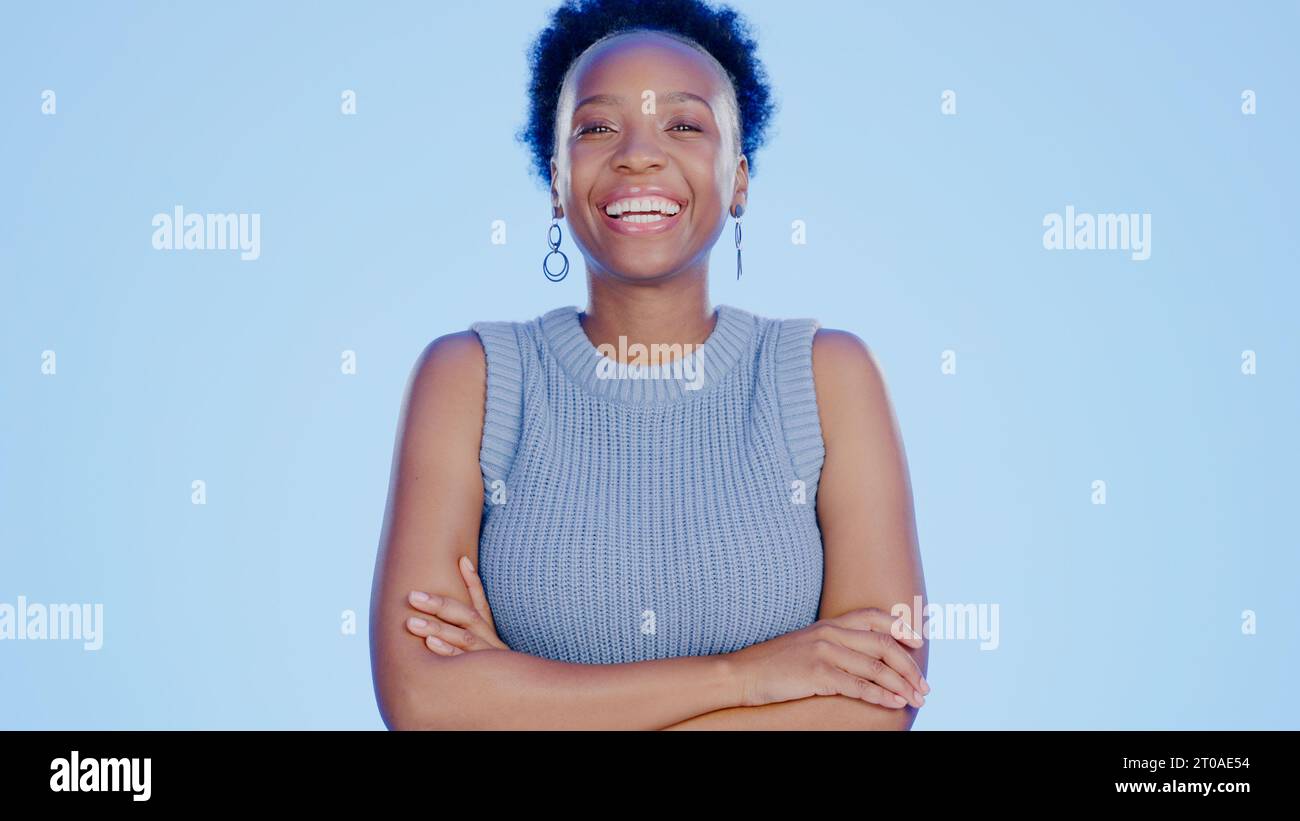 Smile, crossed arms and portrait of black woman in a studio with ...