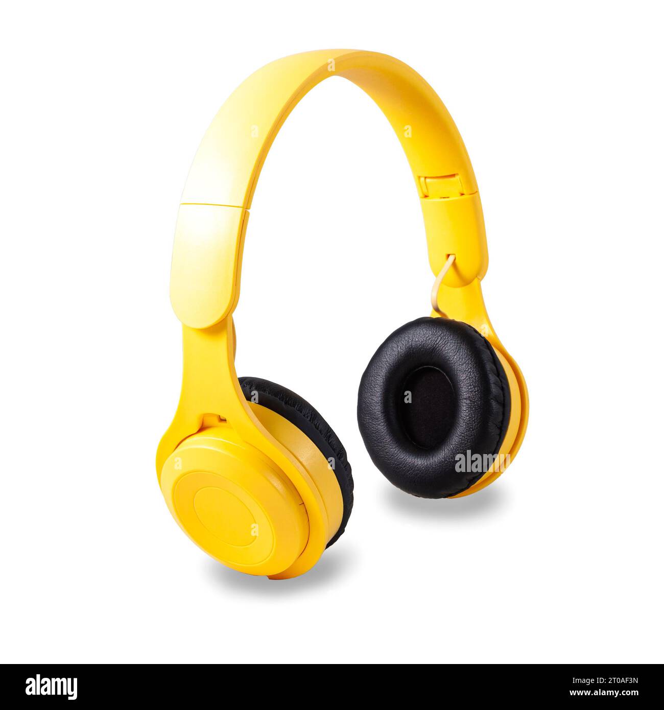 Standing wireless yellow headphones with black earmuffs isolated on
