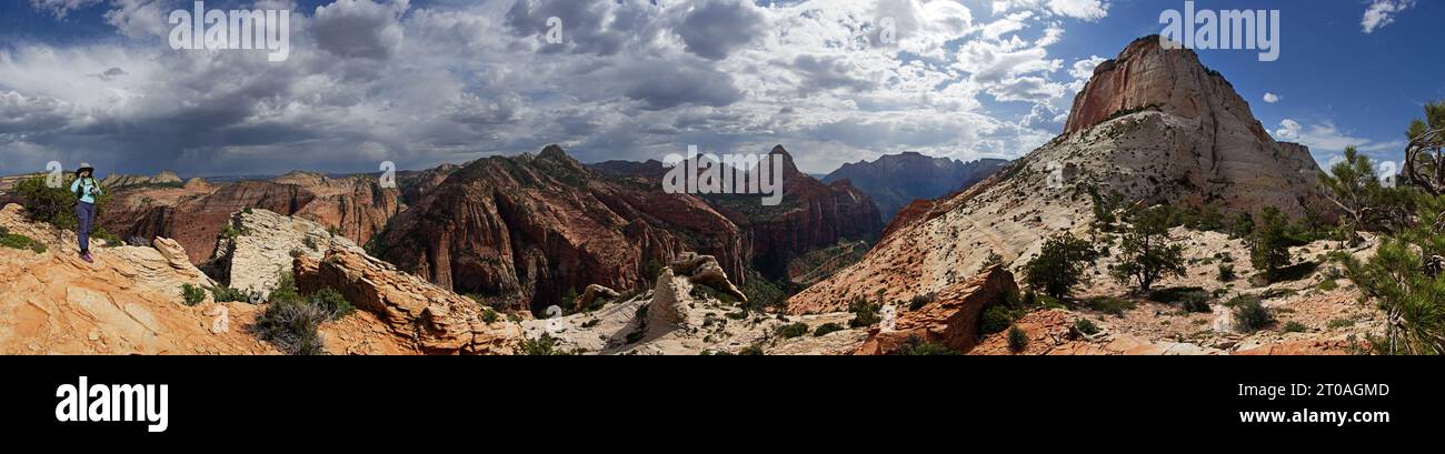 panorama from Shelf Point in Zion National Park with a woman and bridge Mountain and East Temple Stock Photo