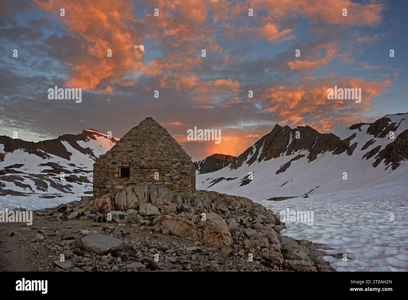 Muir Hut at Muir Pass on the PCT and JMT in Kings Canyon National Park at sunset in July Stock Photo