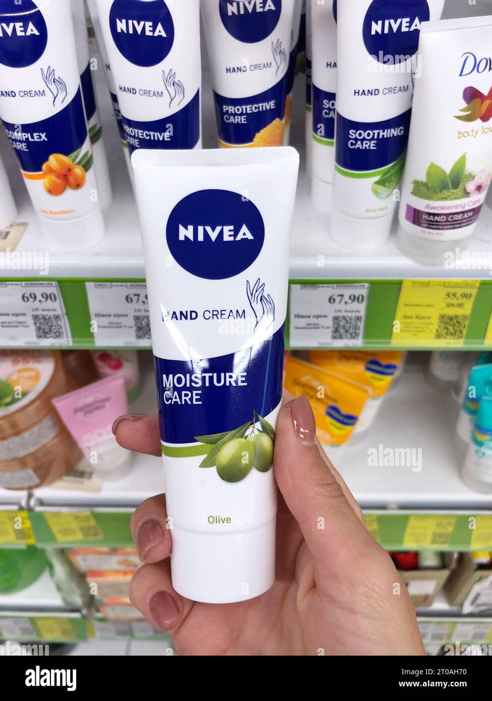 04.10.2023 Kharkov, Ukraine, Nivea cream in a woman's hand. Nivea is  world's famous skin cream Stock Photo - Alamy