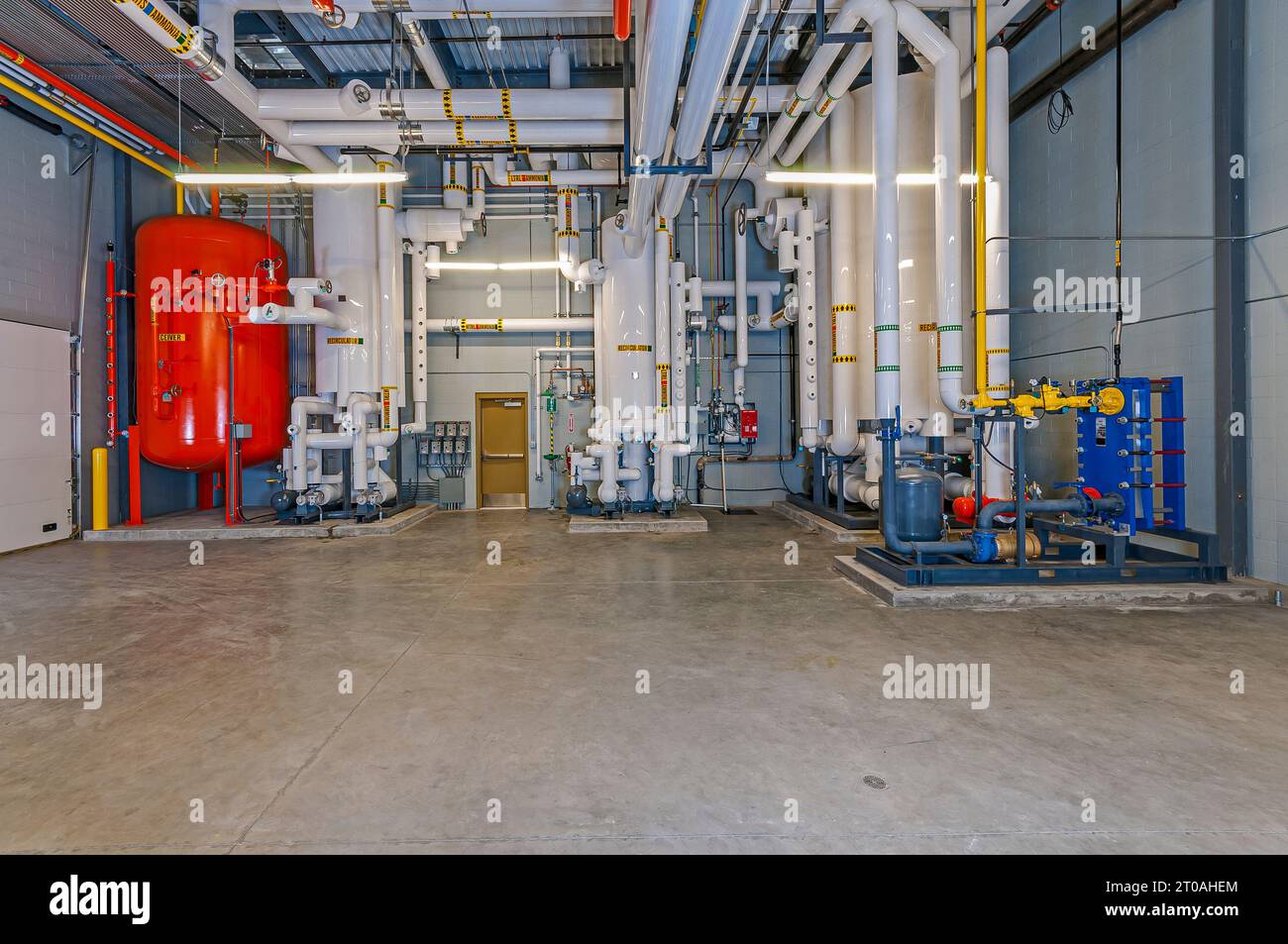 Vertical receiver tank, machinery, and piping in the ammoniacycle