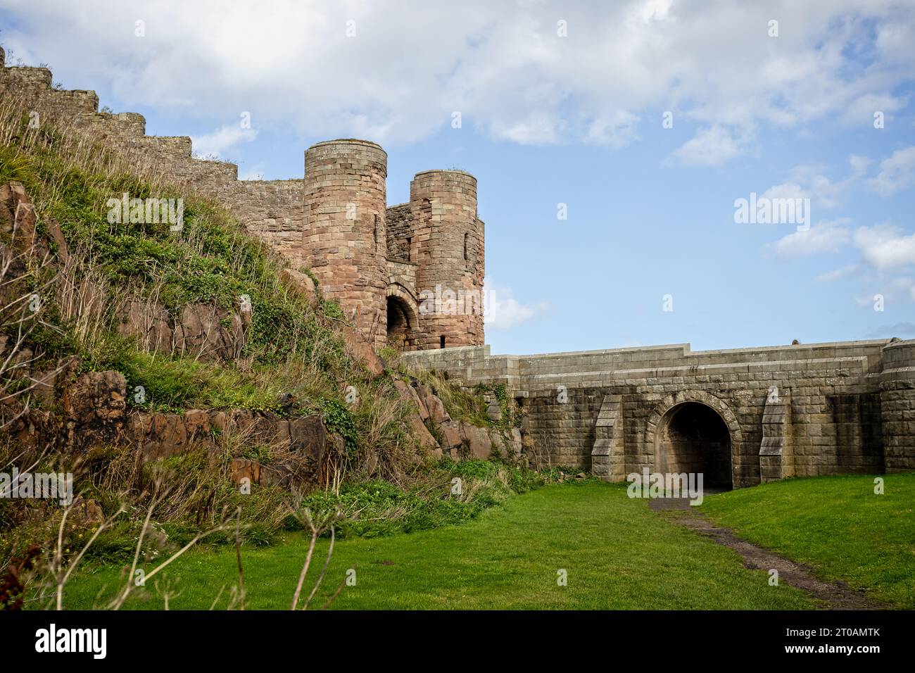 View of Bamburgh Castle and entrance gate in Bamburgh, Northumberland ...