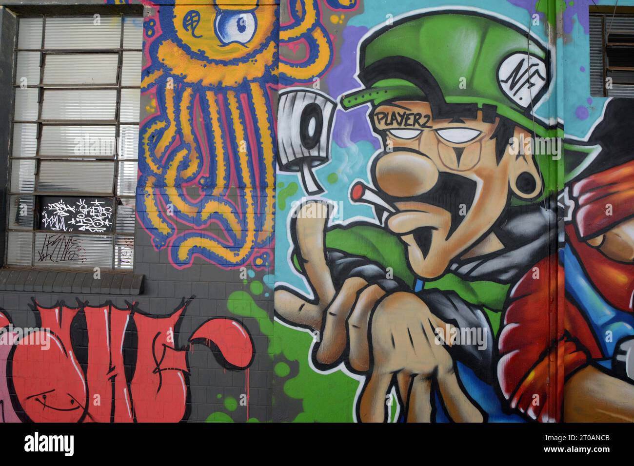 City: Marilia, São Paulo, Brazil - 2023 July 2023 : Graffiti on masonry wall with face in various styles and colors. Brazil Stock Photo