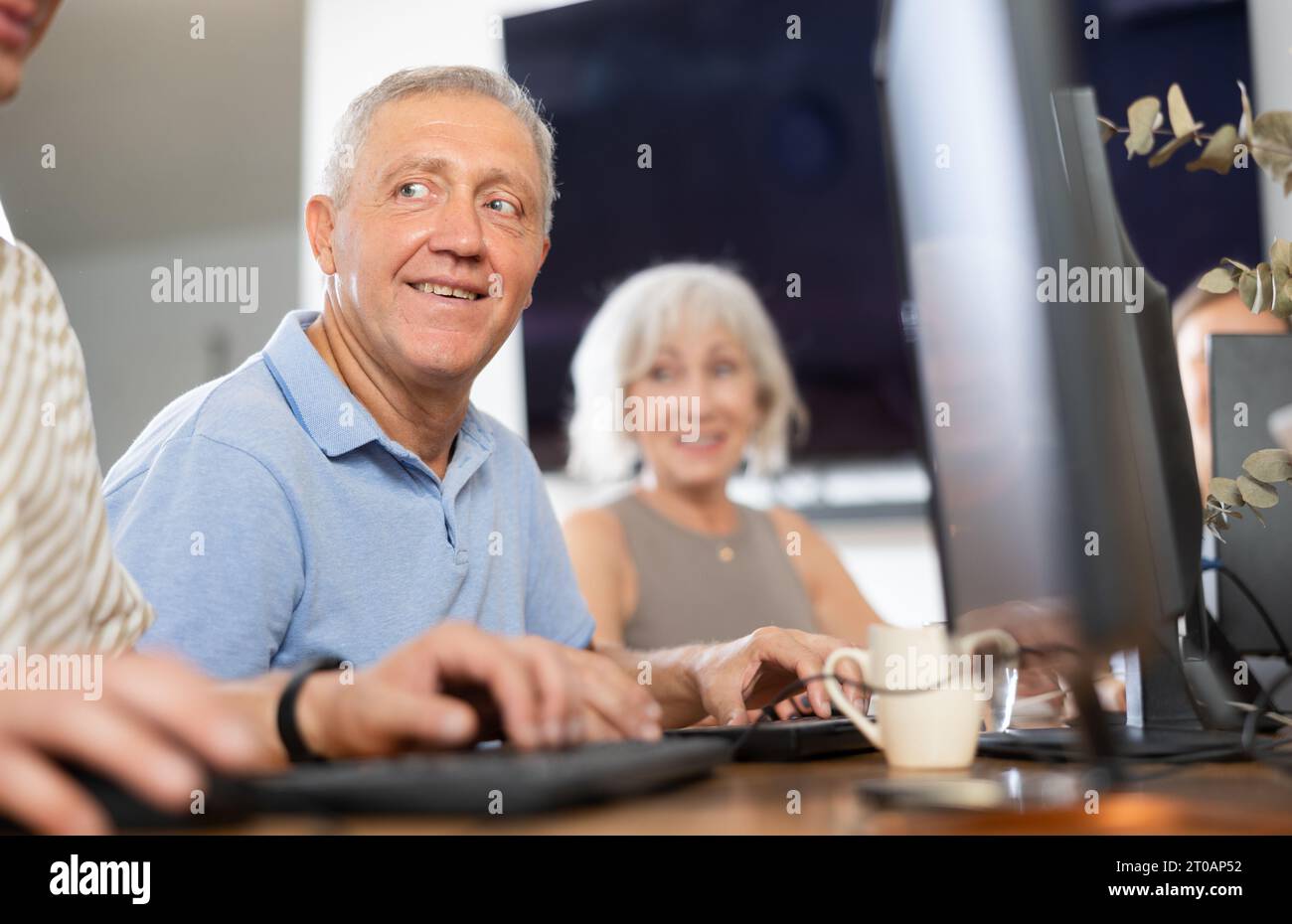Smiling motivated older man hi-res stock photography and images - Alamy