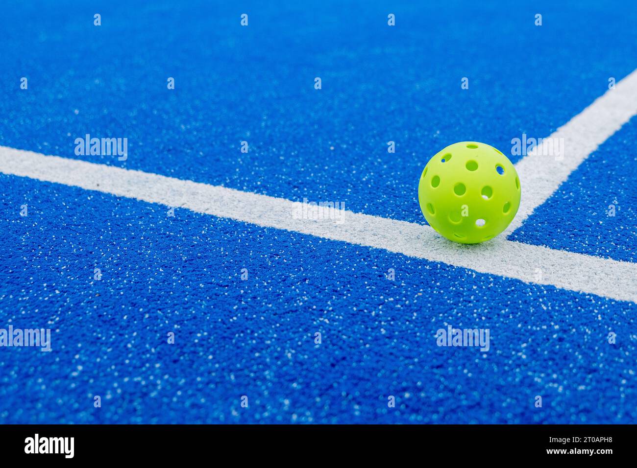 Isolated green pickleball ball in a court Stock Photo Alamy
