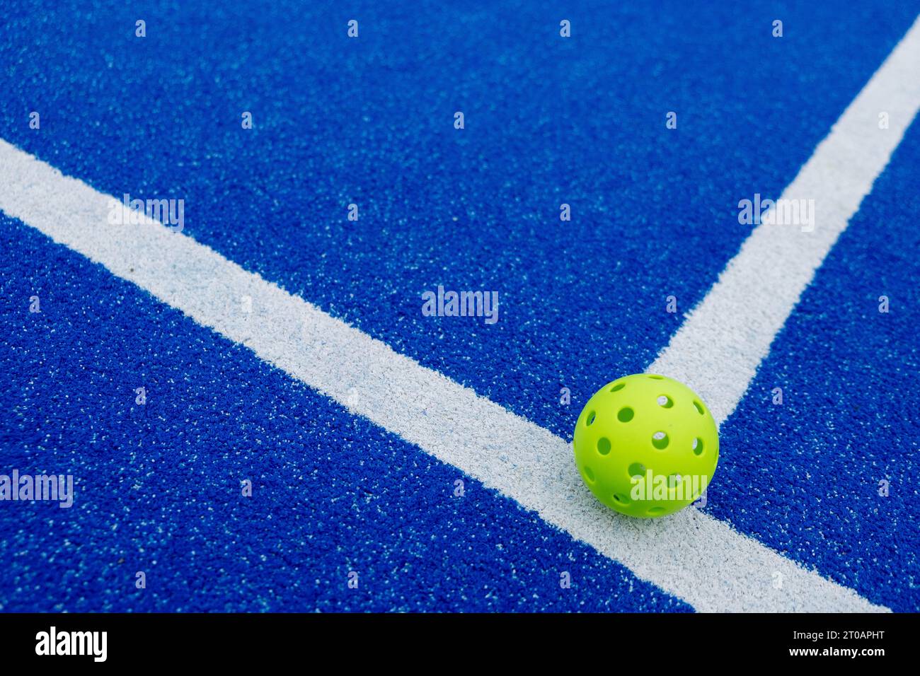 Isolated green pickleball ball in a court Stock Photo Alamy