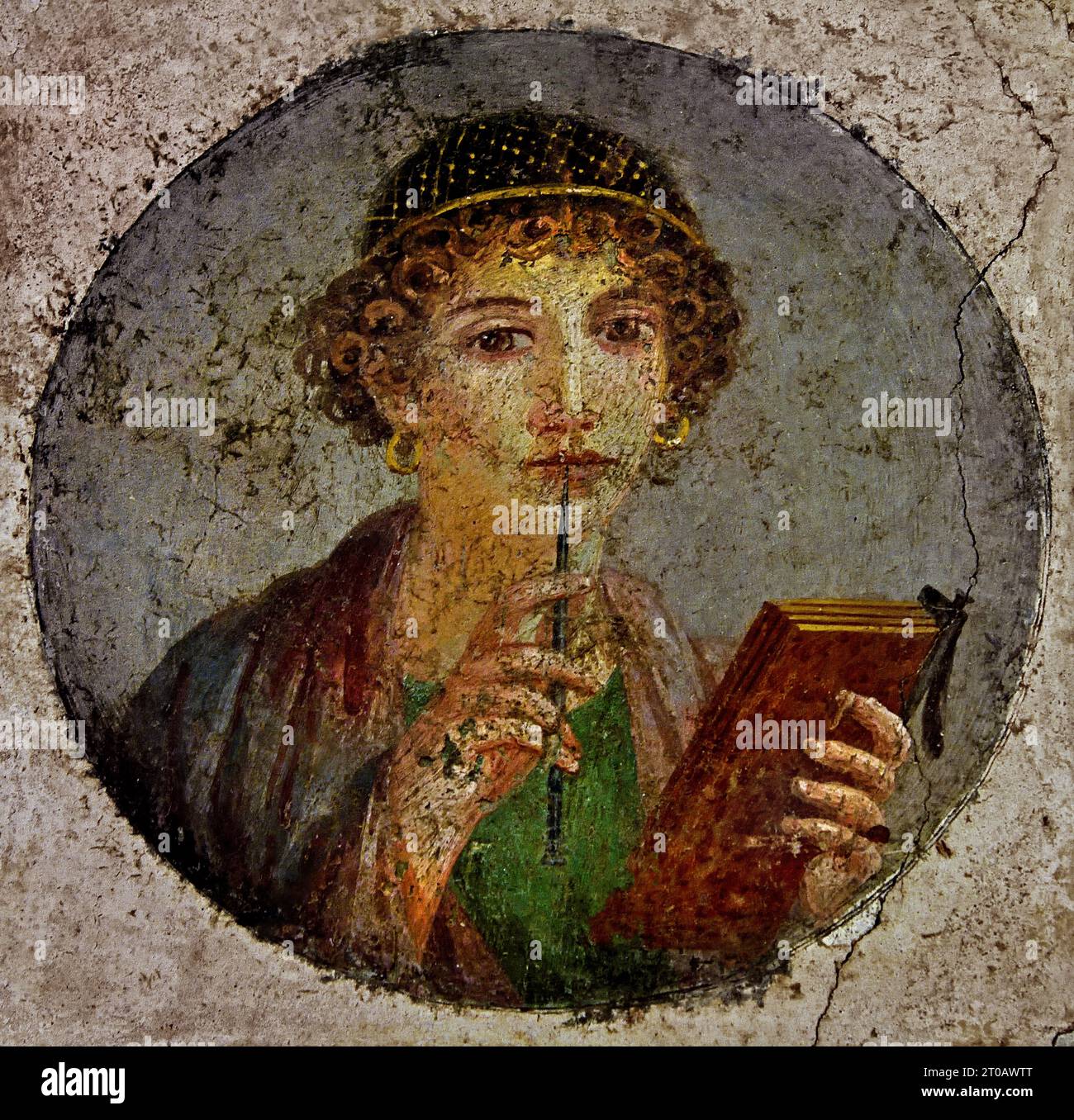 Fresco depicts a writer waiting for inspiration. It is identified with the Greek poet Sappho (c.612-c..570 B.C.).  Pompeii Roman City is located near Naples in the Campania region of Italy. Pompeii was buried under 4-6 m of volcanic ash and pumice in the eruption of Mount Vesuvius in AD 79. Italy Stock Photo