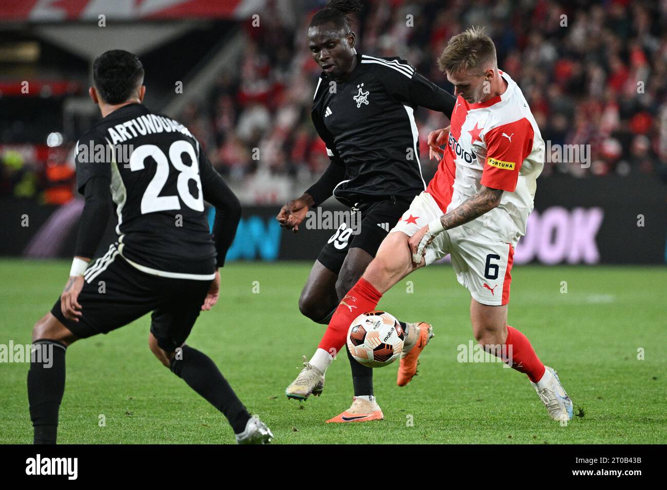 Prague, Czech Republic. 05th Oct, 2023. Soccer players L-R Armel Zohouri of  Tiraspol and Andres Dumitrescu of Slavia Praha in action during the  Football Europe League 2nd round match, group G match