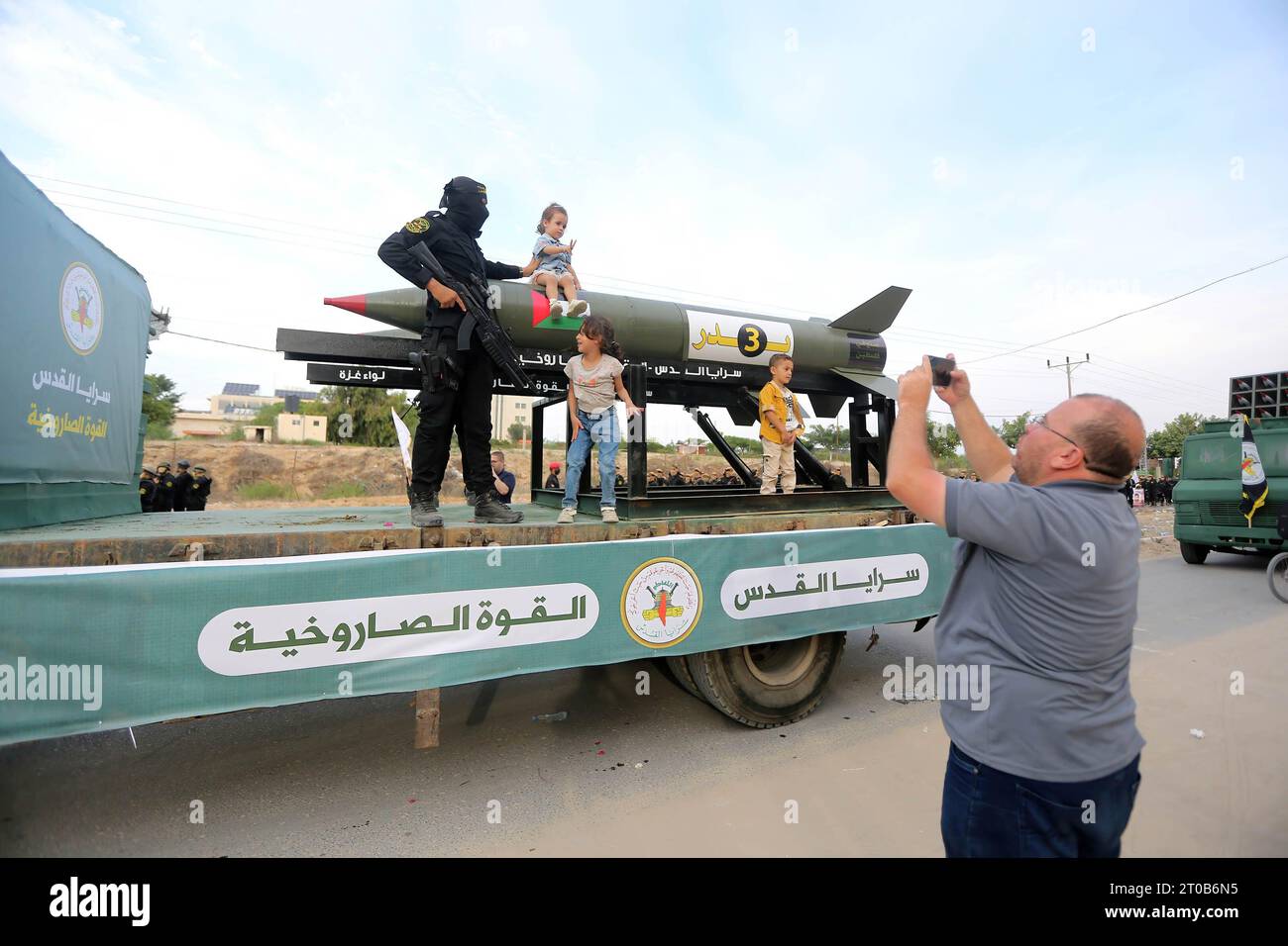 Members of the Al-Quds Brigades, the military wing of the Islamic Jihad movement, participate in an anti-Israel military parade on the occasion of the 36th anniversary of the founding of the movement in Gaza City. Stock Photo