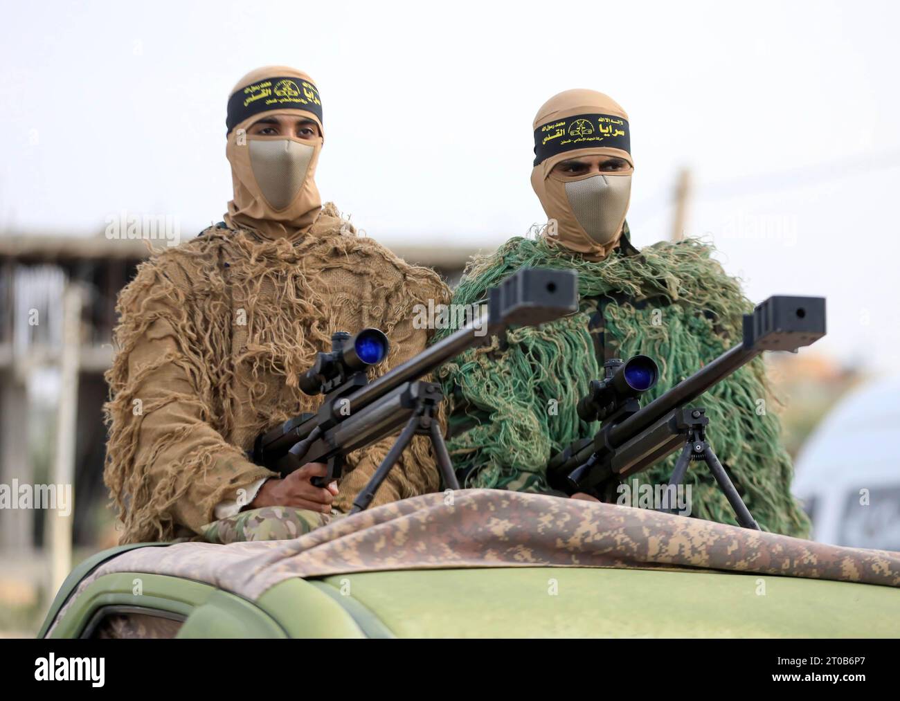 Members of the Al-Quds Brigades, the military wing of the Islamic Jihad movement, participate in an anti-Israel military parade on the occasion of the 36th anniversary of the founding of the movement in Gaza City. Stock Photo