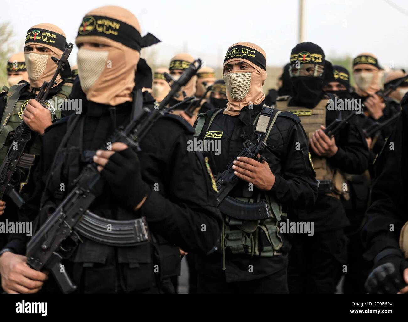 Members of the Al-Quds Brigades, the military wing of the Islamic Jihad movement, participate in an anti-Israel military parade on the occasion of the 36th anniversary of the founding of the movement in Gaza City. Stock Photo